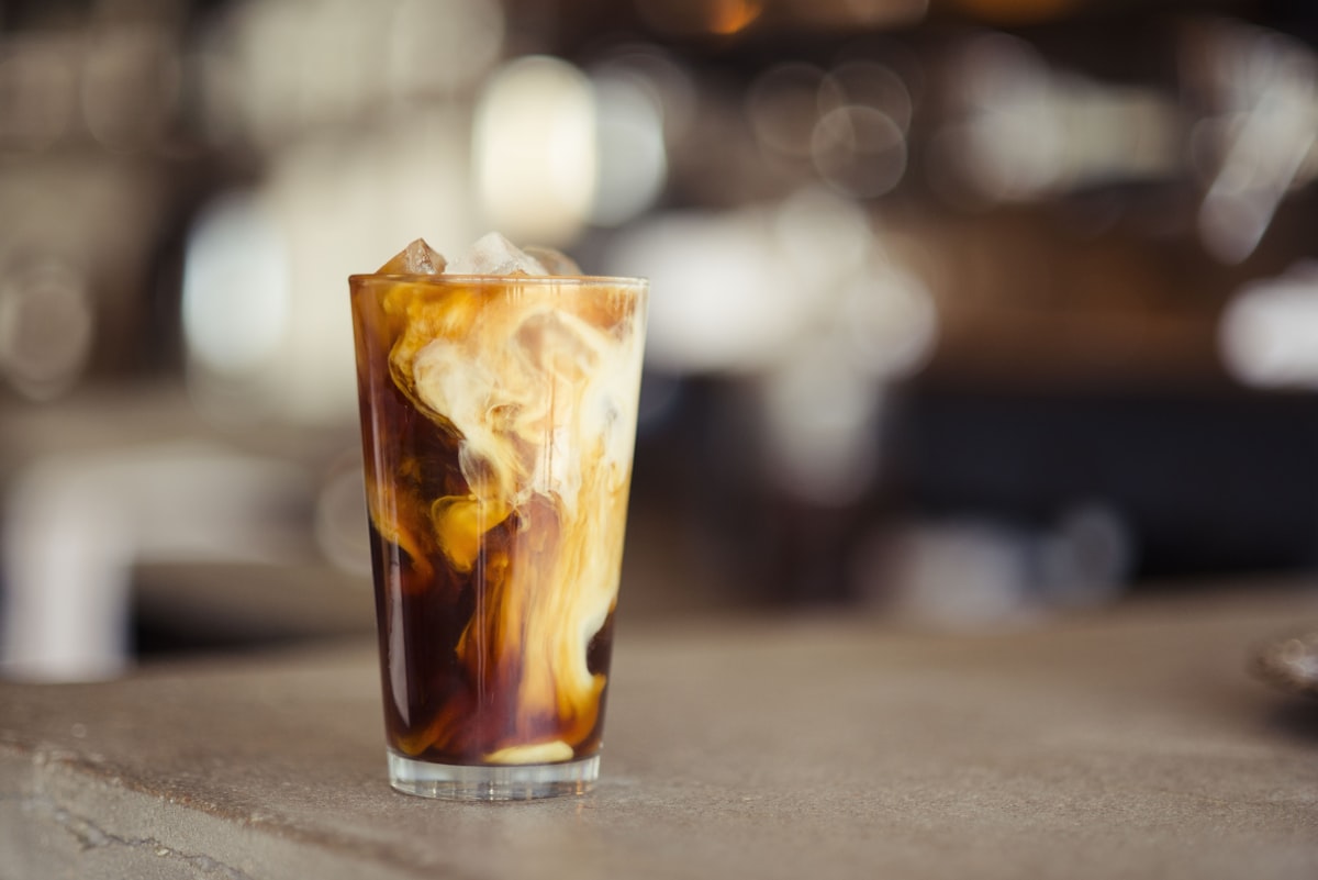 An iced coffee catching the light