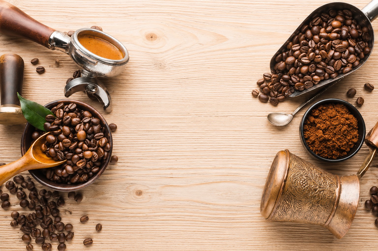 Coffee beans scattered across a white background